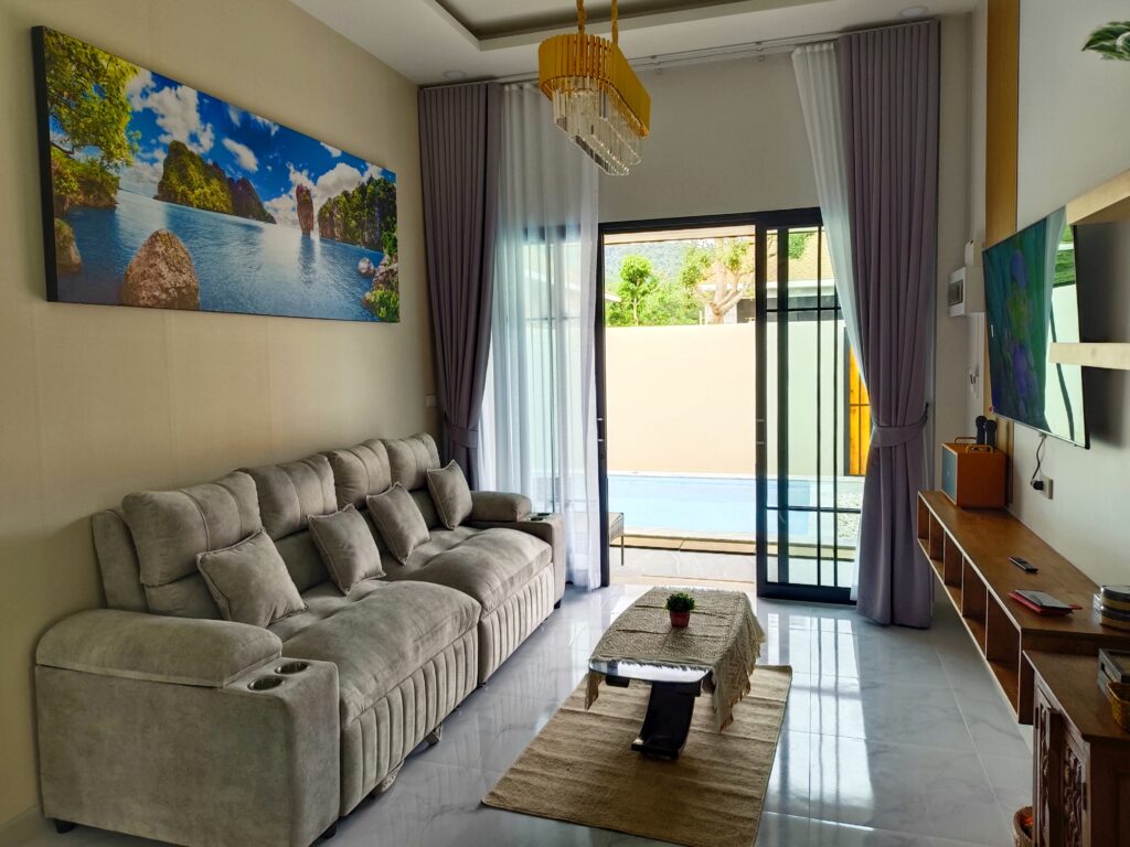 living room with sofa bed and smart TV